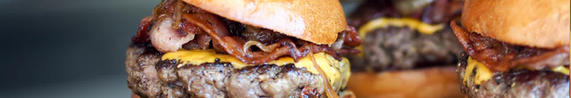 Eating Burger Food Stand at Art Bradish Snack Bar restaurant in North Grafton, MA.